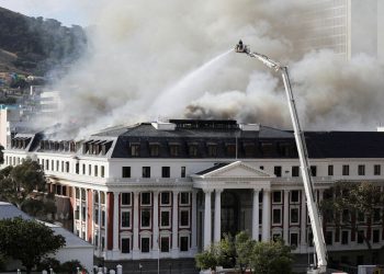 Prosecutors in South Africa charge parliament fire suspect with terrorism