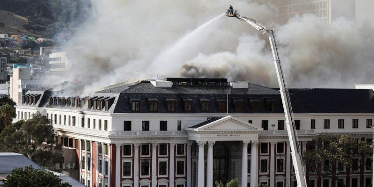 Prosecutors in South Africa charge parliament fire suspect with terrorism