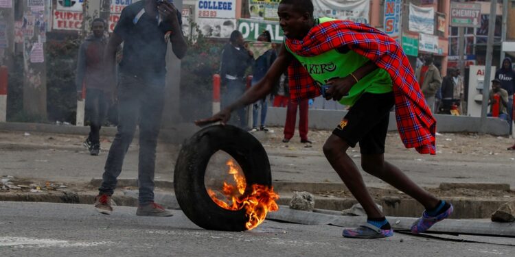 Kenya police fire tear gas as anti-government protesters burn tyres