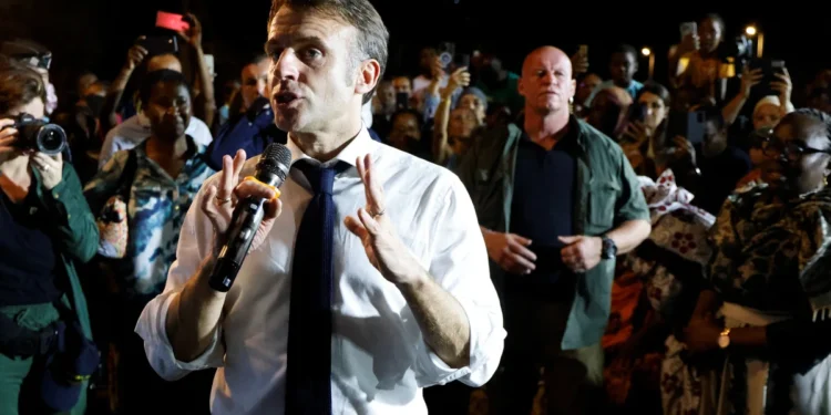 France’s Macron swears in angry exchange with residents of cyclone-hit Mayotte